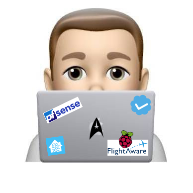Apple MeMoji of a male sitting behind a laptop, there are stickers on the laptop cover.